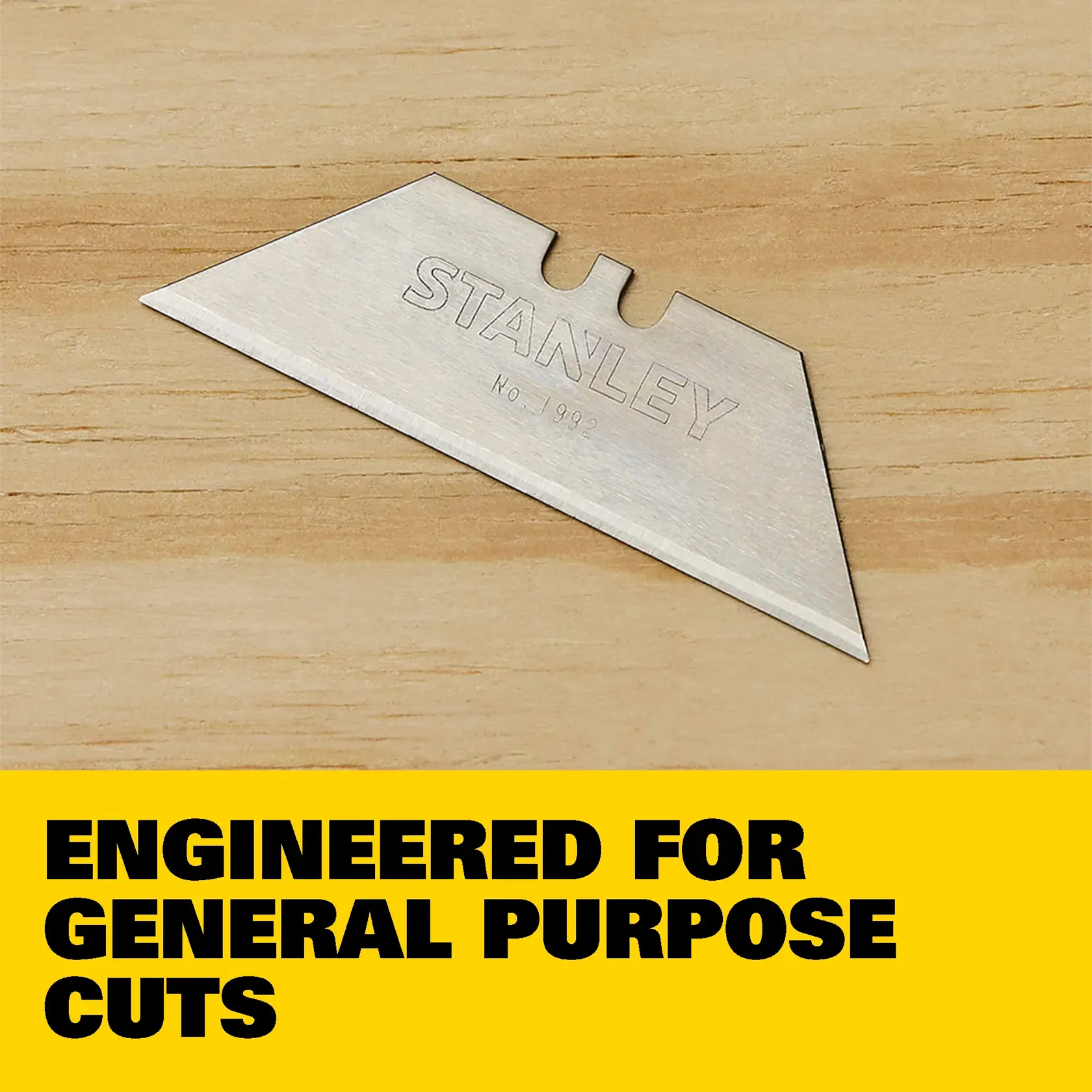 Image showing a Stanley heavy-duty utility knife blade with highlighted features: precision honed edge, compatible with utility knives, made from heavy-duty steel, includes five all-purpose blades. 'Made in USA with global materials' label is shown in the bottom left.