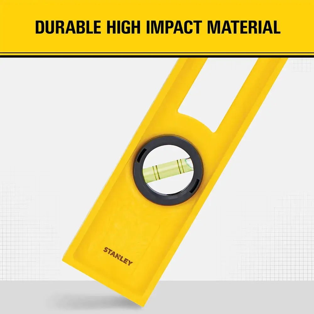 A yellow Stanley spirit level, made from durable high-impact material, is shown with a circular vial and the words 'DURABLE HIGH IMPACT MATERIAL' above.