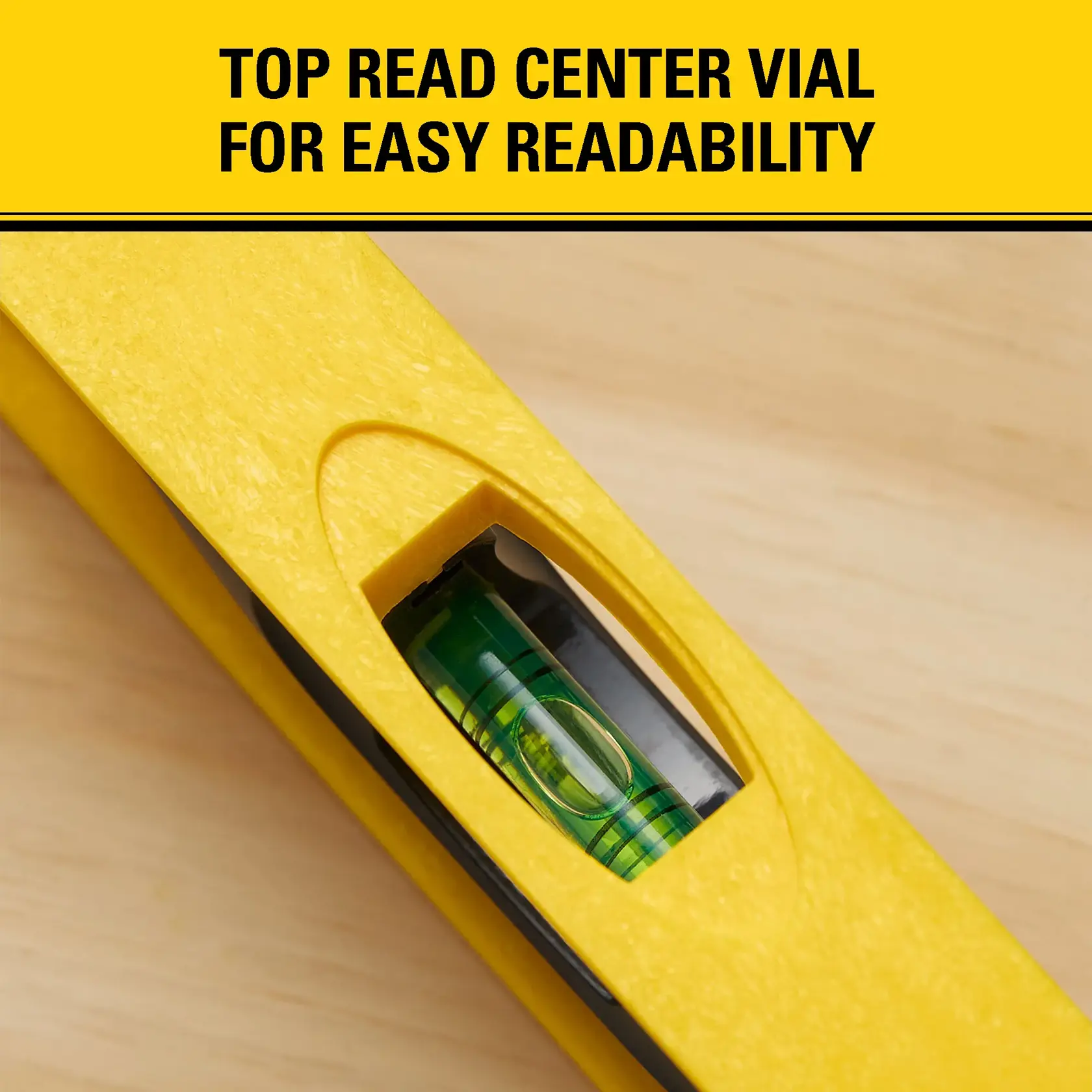 Close-up of a yellow spirit level showing the top-read center vial for easy readability. Text above reads: 'TOP READ CENTER VIAL FOR EASY READABILITY.'