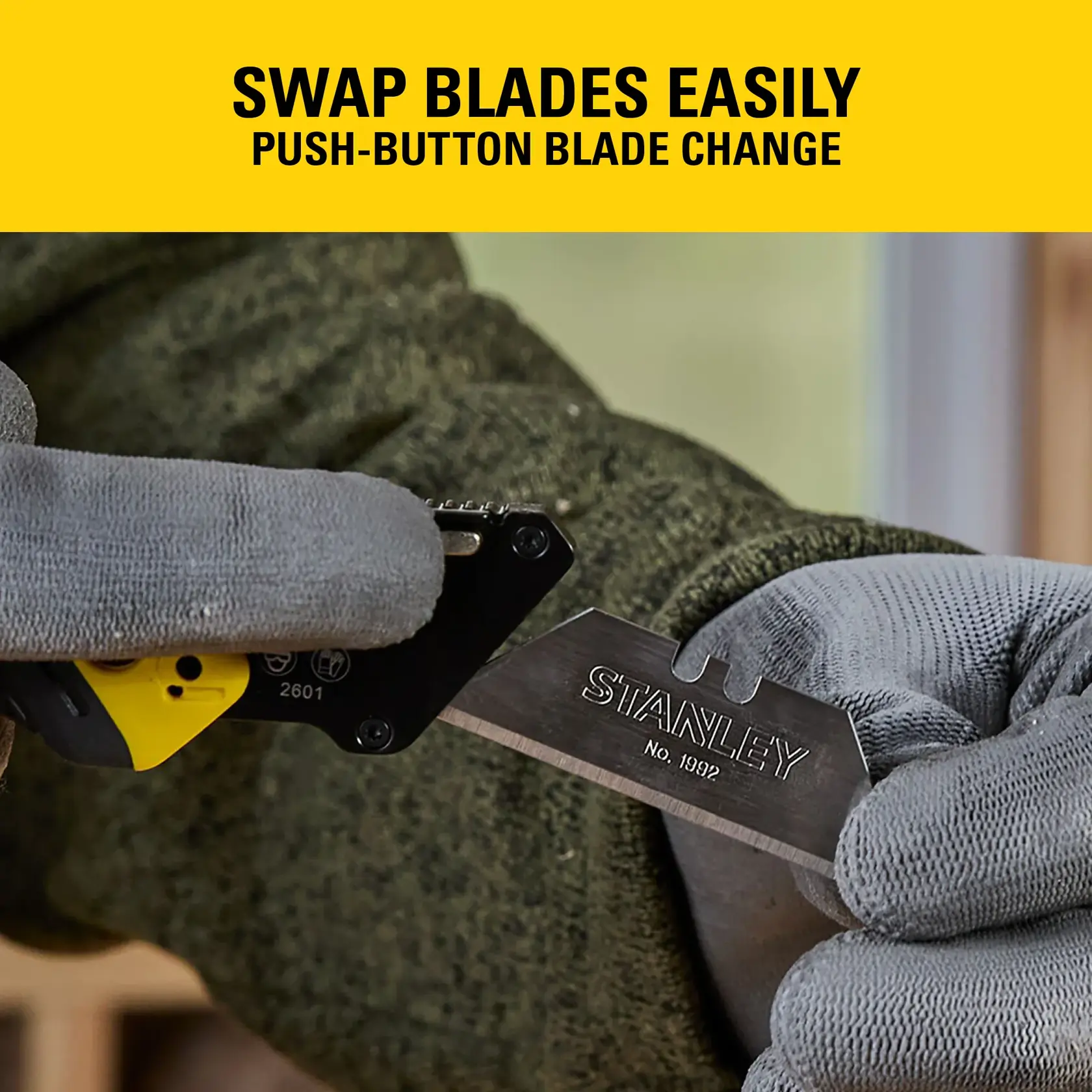 Gloved hands changing a STANLEY utility knife blade with a push-button. Yellow banner with blade swap text.