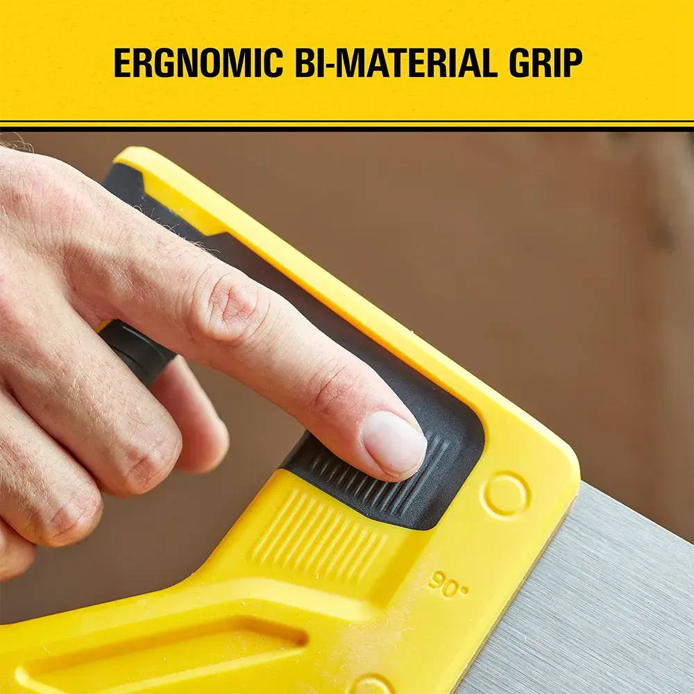 Close-up of a hand holding a yellow and black saw handle, highlighting the ergonomic bi-material grip.