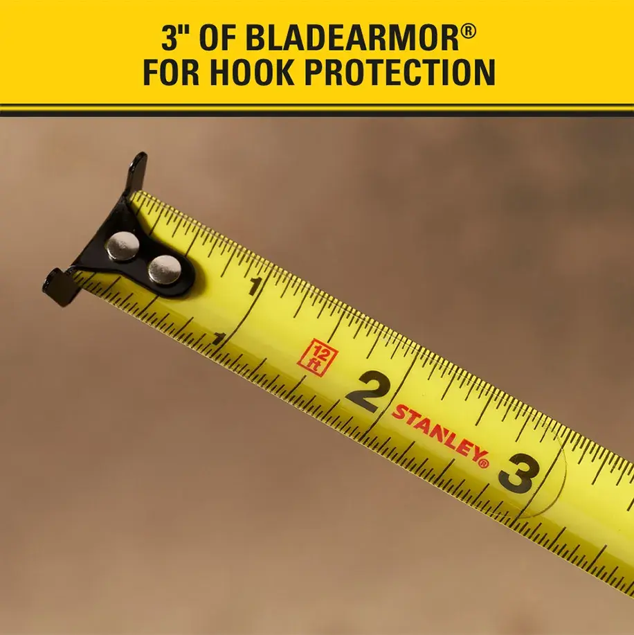 Close-up of a yellow STANLEY tape measure showing the first three inches, highlighting the BladeArmor hook protection feature.