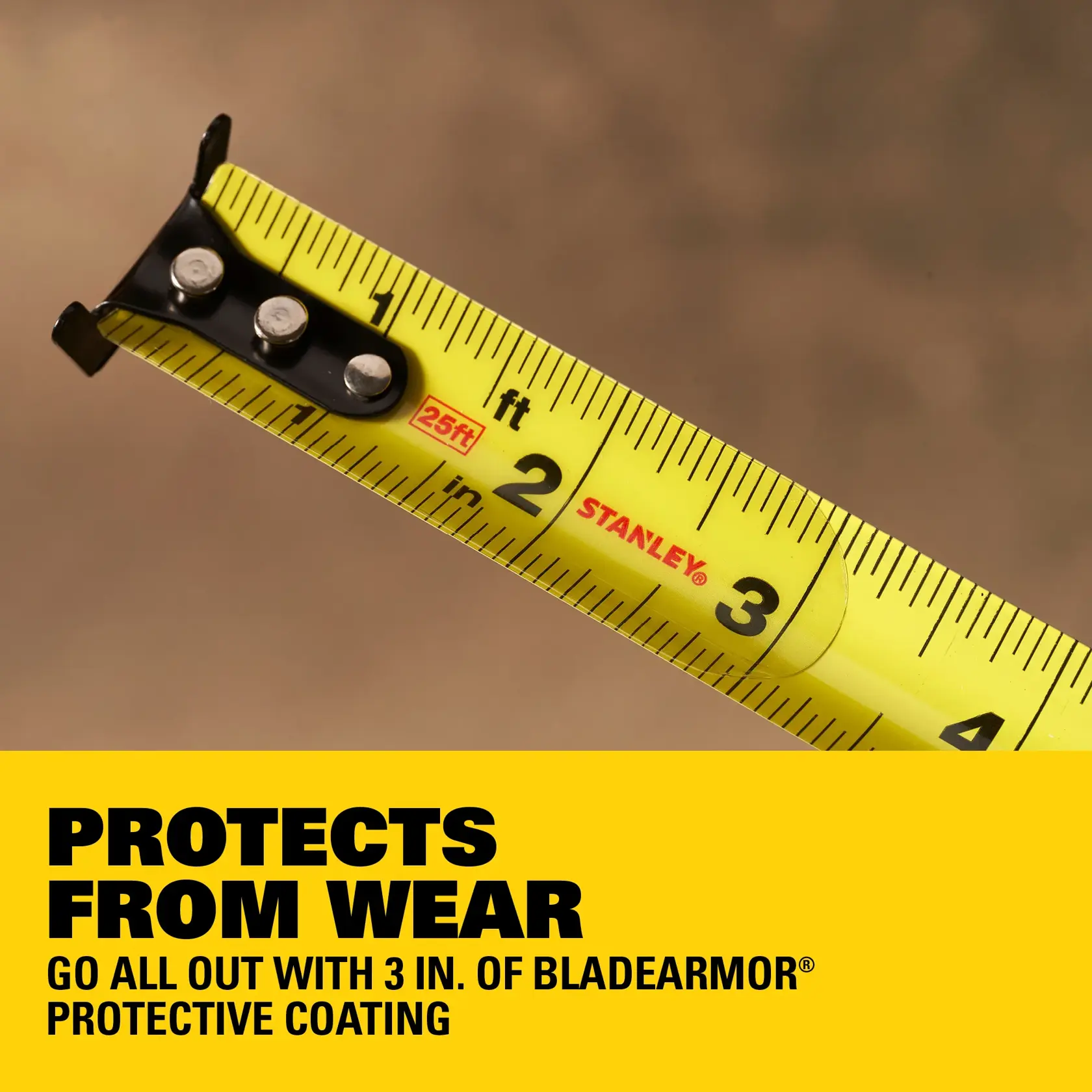 A close-up of a hand holding a Stanley Control-Lock 25 ft tape measure, emphasizing the integrated finger brake feature for improved blade control. The background is blurred, and a yellow banner at the top reads: 'INTEGRATED FINGER BRAKE FOR IMPROVED BLADE CONTROL.'
