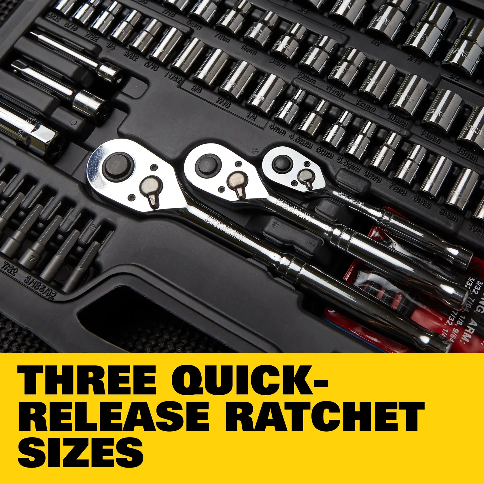 Stanley tool kit set STMT71654 displayed, includes various ratchets, sockets, wrenches, hex keys, nut bits, specialty bits, and extension bars. The kit contents are listed on a yellow background beneath the tools.